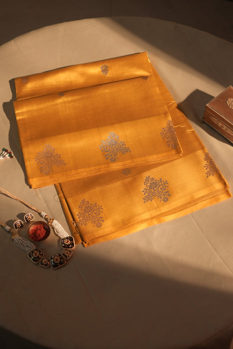 Deep Yellow Floral Butti Border Banarasi Silk Saree With Blouse Piece