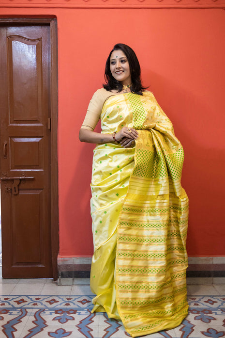 Light Lemon Yellow Assam Silk Saree with Forest Green and Golden Zari Work With Blouse Piece