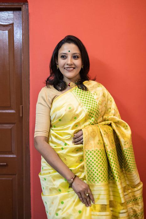 Light Lemon Yellow Assam Silk Saree with Forest Green and Golden Zari Work With Blouse Piece